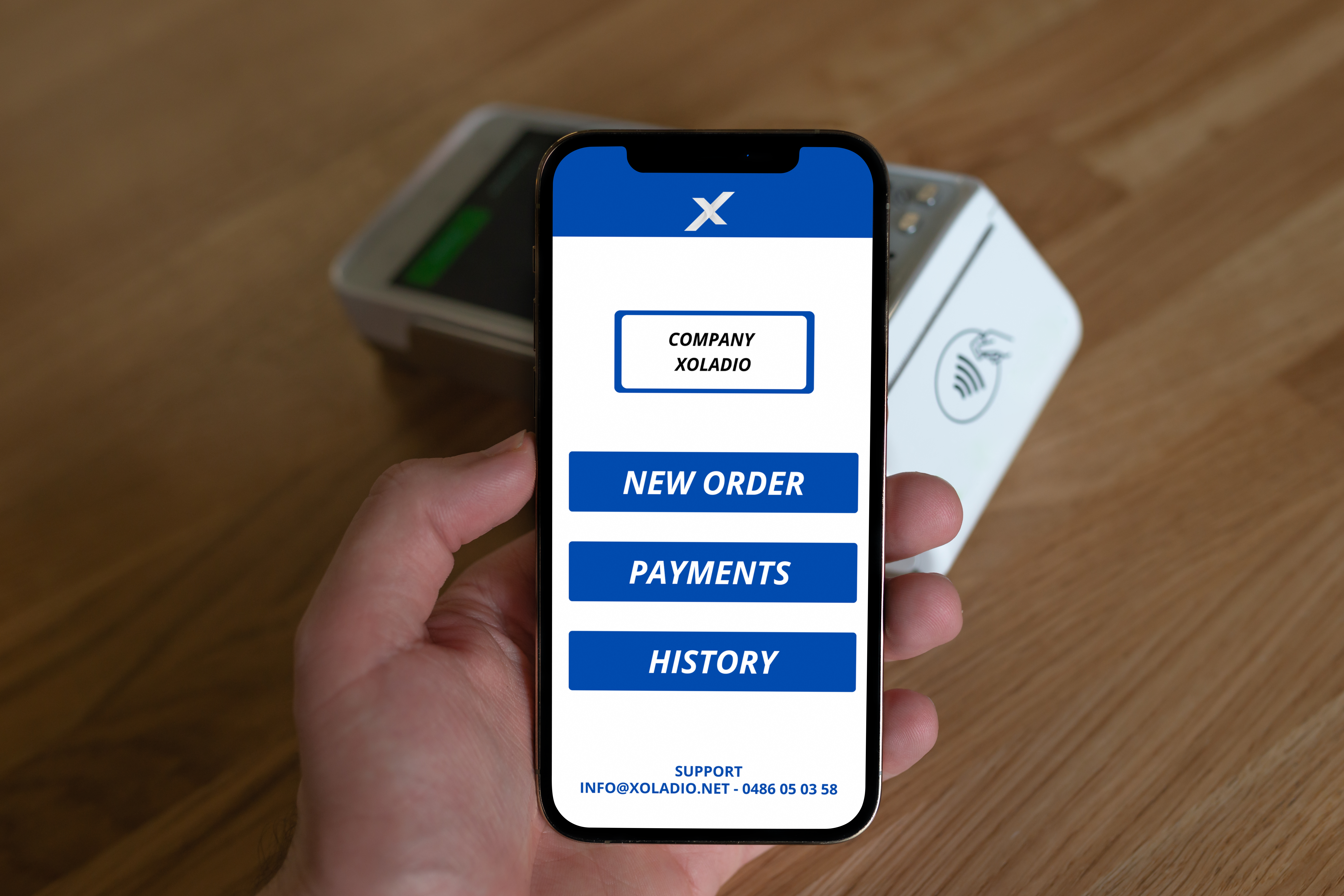 iPhone 12 Pro Mockup in Hand over POS Terminal